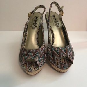 Coach and four wedge heels